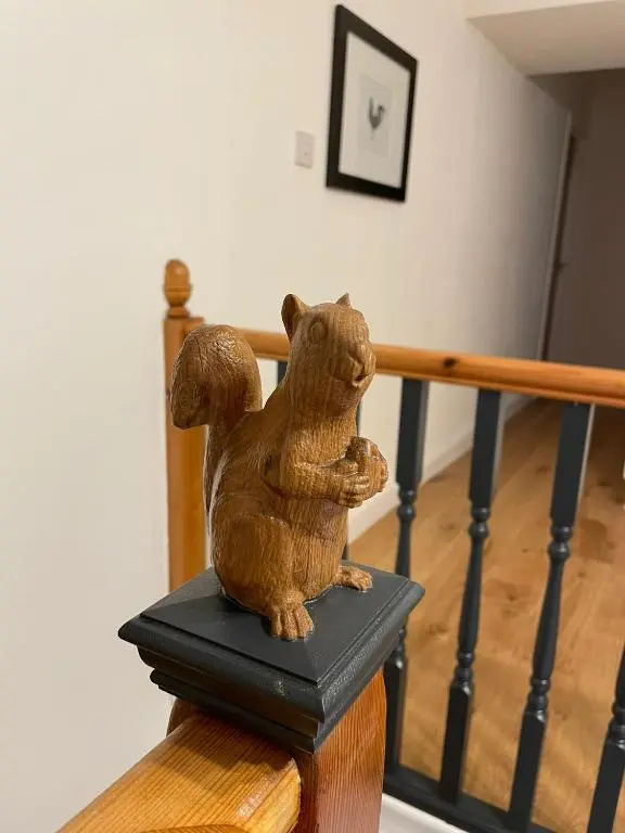 a statue of a cat sitting on top of a table at Crannach House bed and breakfast and self catering apartments in Ballater
