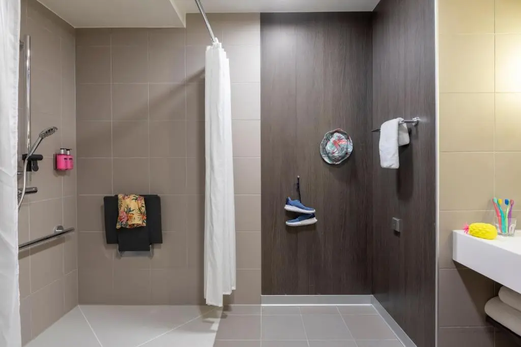 a bathroom with a shower and a sink at Moxy Aberdeen Airport in Dyce