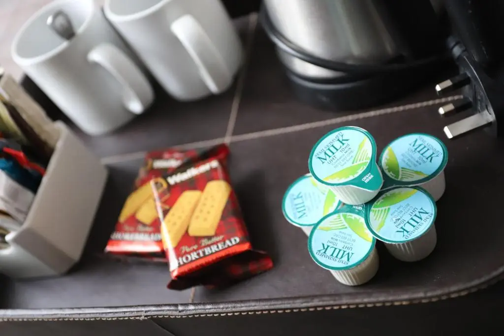 a bunch of stickers on top of a suitcase at Ben Wyvis Hotel in Strathpeffer