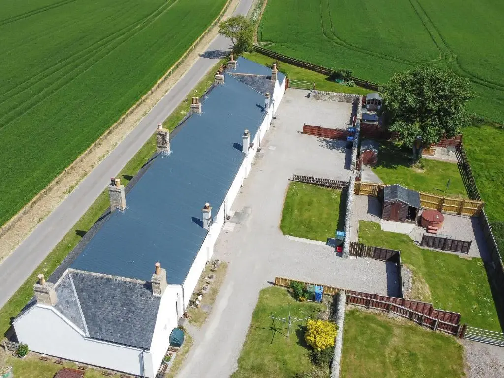 an aerial view of a canal in a field at The Paddock in Portmahomack