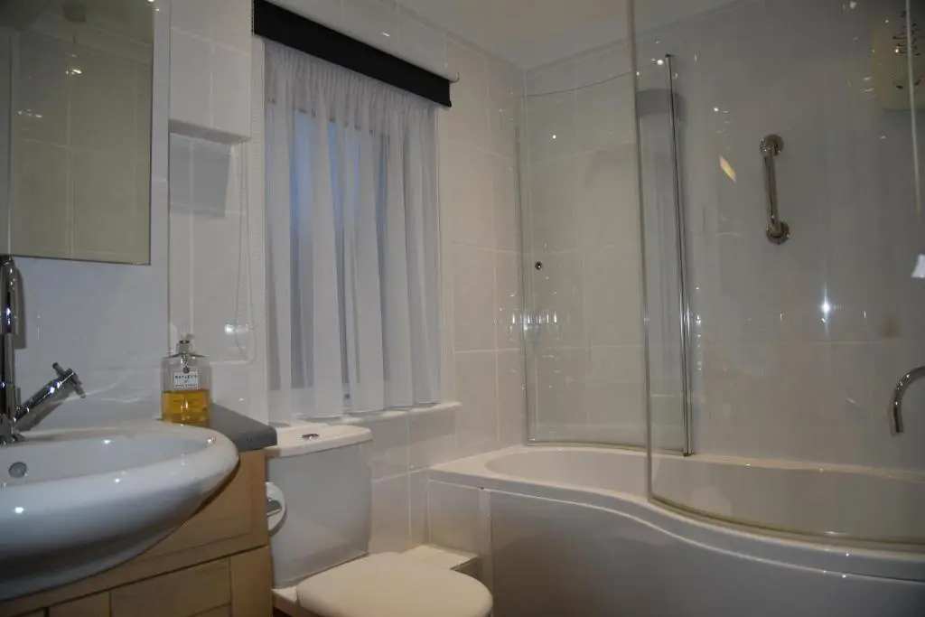 a bathroom with a sink and a toilet and a shower at Chapelhill Croft in Keith