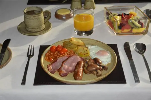 a plate of food on a table with a plate of food at Chapelhill Croft in Keith