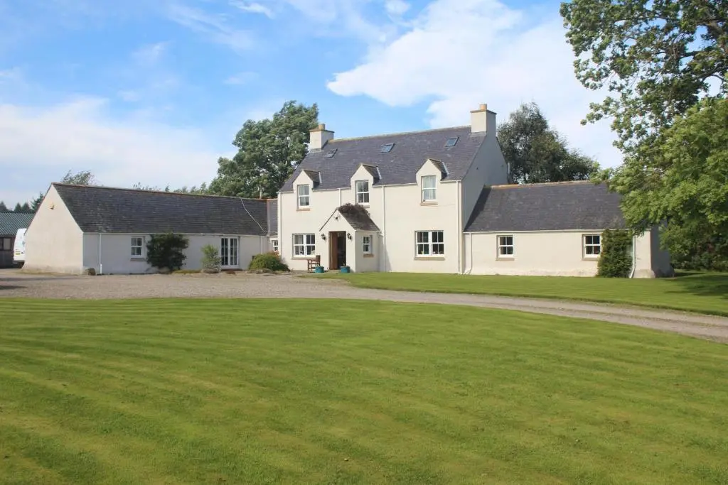 a large white house with a large yard at The Annex - Easter Arr in Auldearn
