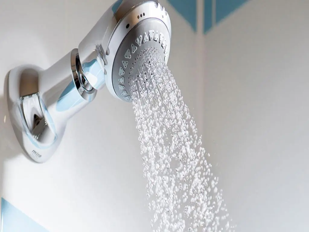 a shower head with water coming out of it at Leonardo Hotel Inverness in Inverness