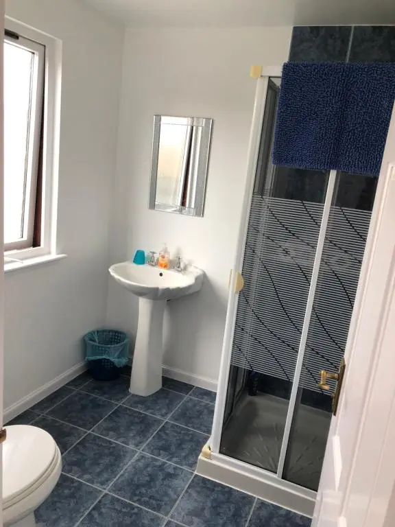 a bathroom with a shower and a sink at Fairwinds in Inverness
