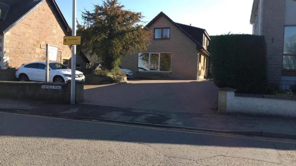 a white car parked in front of a house at Fairwinds in Inverness