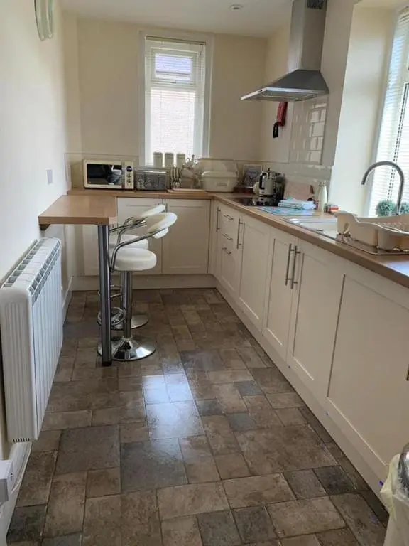 a kitchen with a sink and a counter top at Mary's Apartment in Rothes