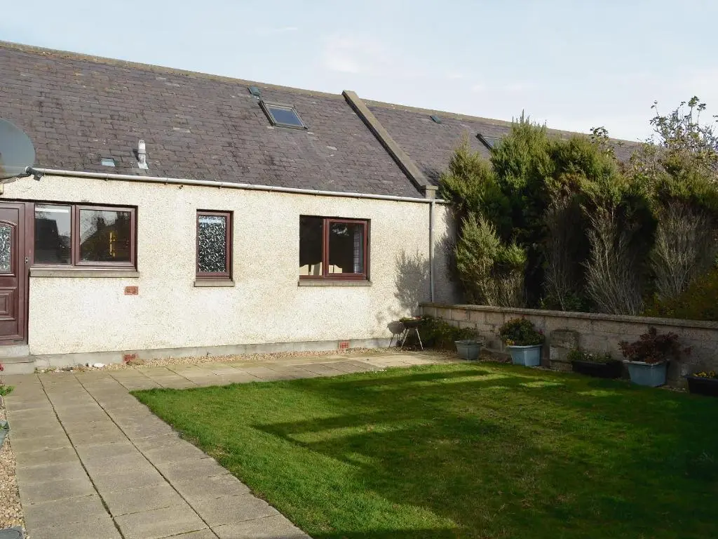 a house with a lawn in front of it at Firth View in Garmouth