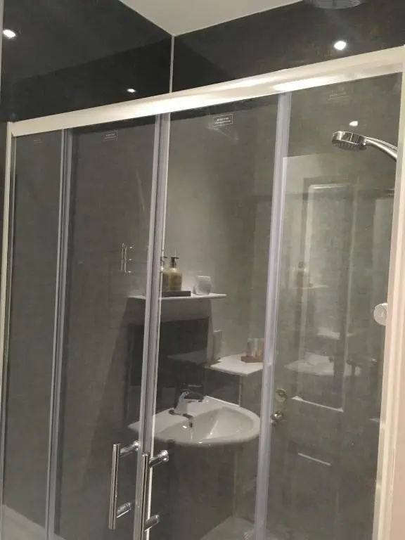 a bathroom with a shower and a sink at Urrard B&B in Dingwall