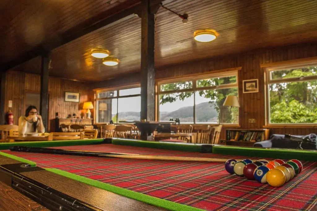 a room with a pool table in a restaurant at Loch Ness Lochside Hostel - Over 16s Only in Invermoriston