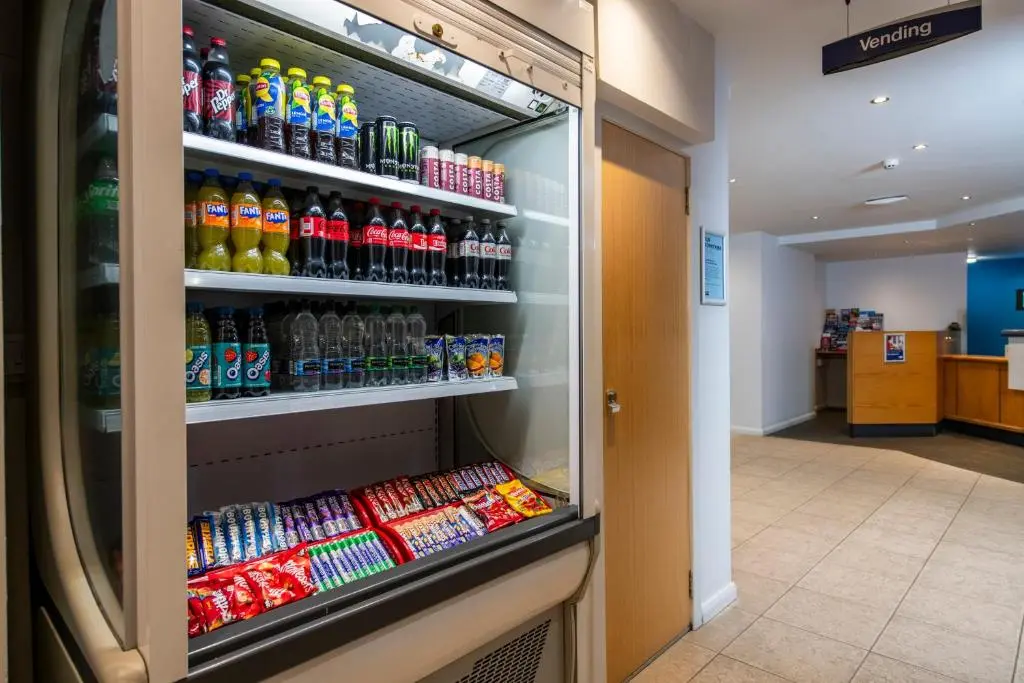 a refrigerator filled with lots of drinks in a store at Holiday Inn Express Inverness by IHG in Inverness