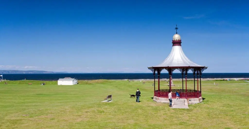 a group of people standing around a gazebo in a field at Sunny Brae Bed & Breakfast in Nairn
