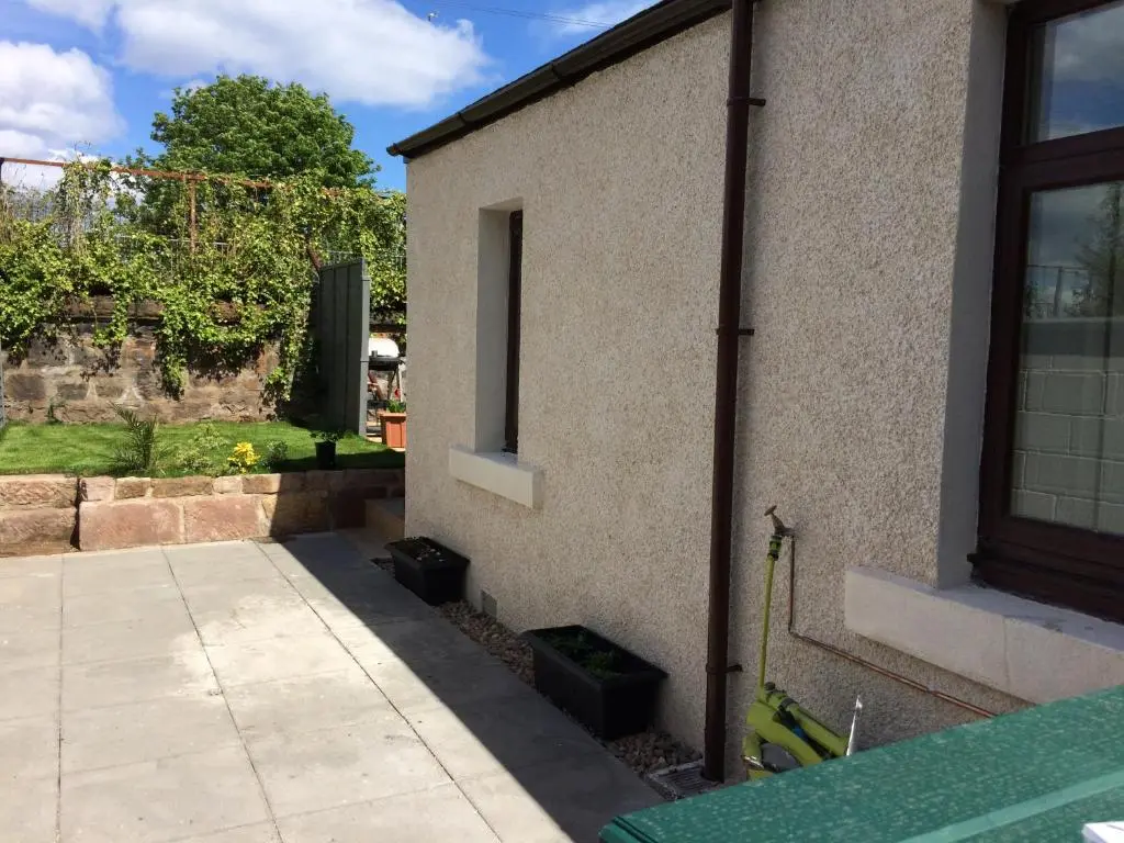 a side view of a building with a window at 32a railside in Inverness