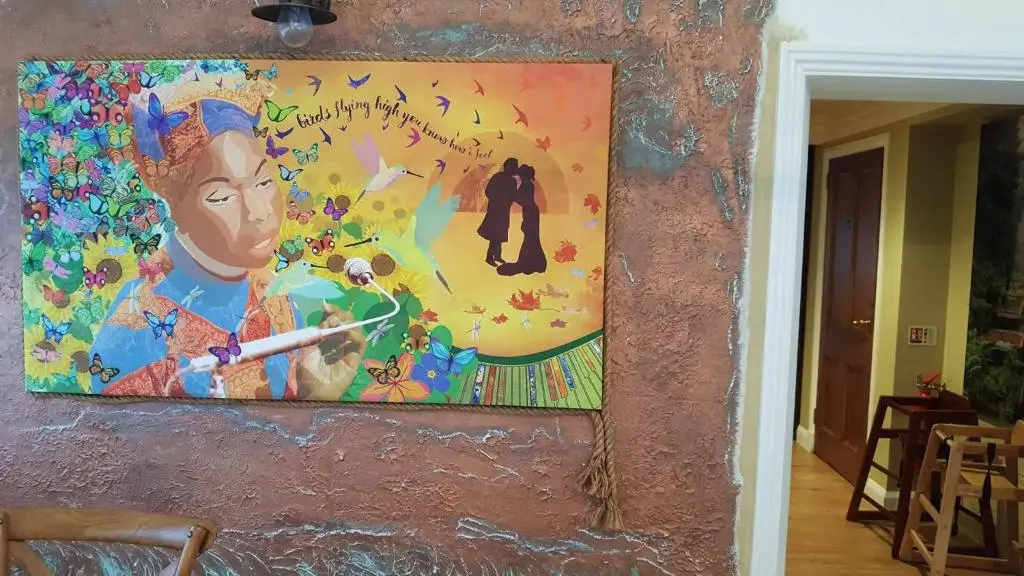 a painting hanging on a wall in a room at The Ship Inn in Invergordon