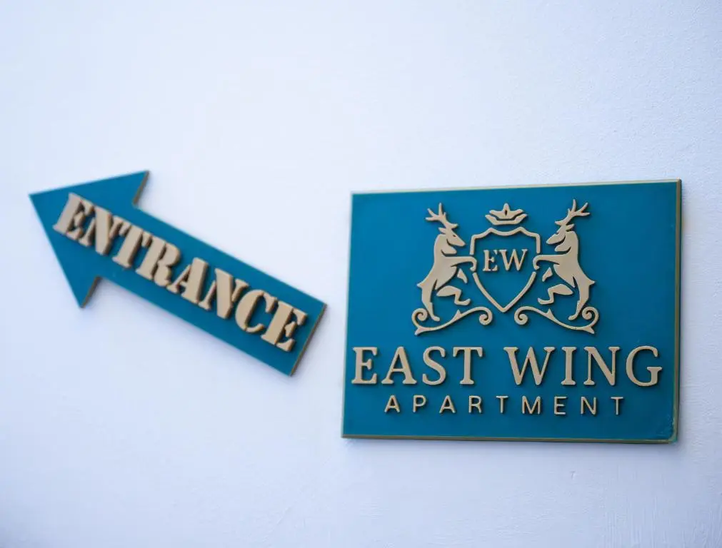 a sign for the new east wing apartment building at East Wing Apartment in Elgin in Elgin