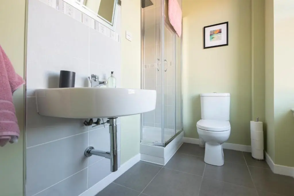 a bathroom with a sink and a toilet at Dryburgh Town House in Inverness