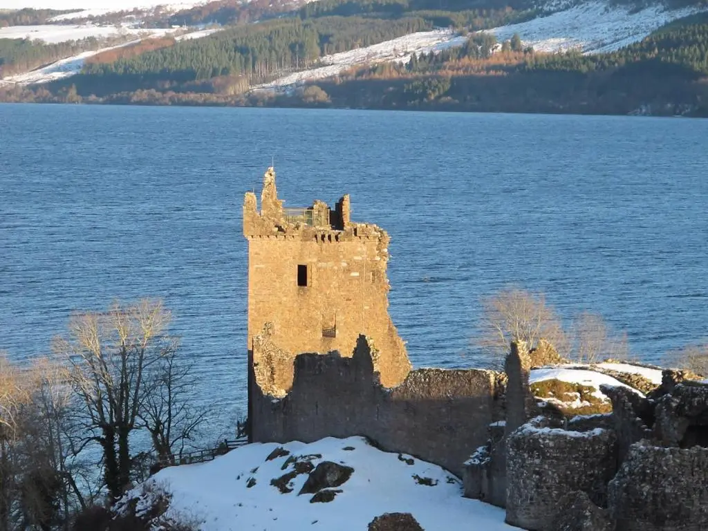 a castle in the middle of a body of water at Royston Guest House Inverness in Inverness