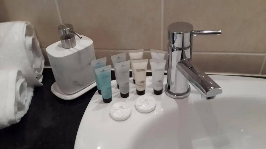 a bathroom sink with a faucet next to a toilet at High March in Drumnadrochit