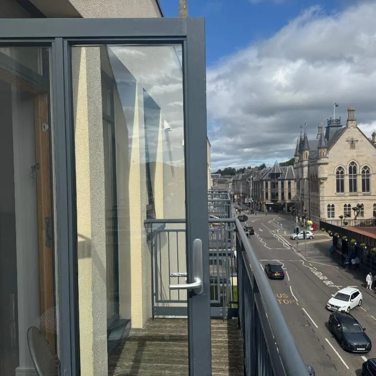 a balcony with a view of a city street at Apartment 306 By the Bridge in Inverness