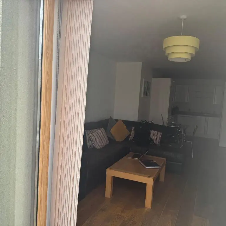 a living room with a couch and a table at Apartment 306 By the Bridge in Inverness