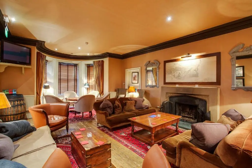 a living room filled with furniture and a fireplace at Royal Golf Hotel, by Highland Coast Hotels in Dornoch