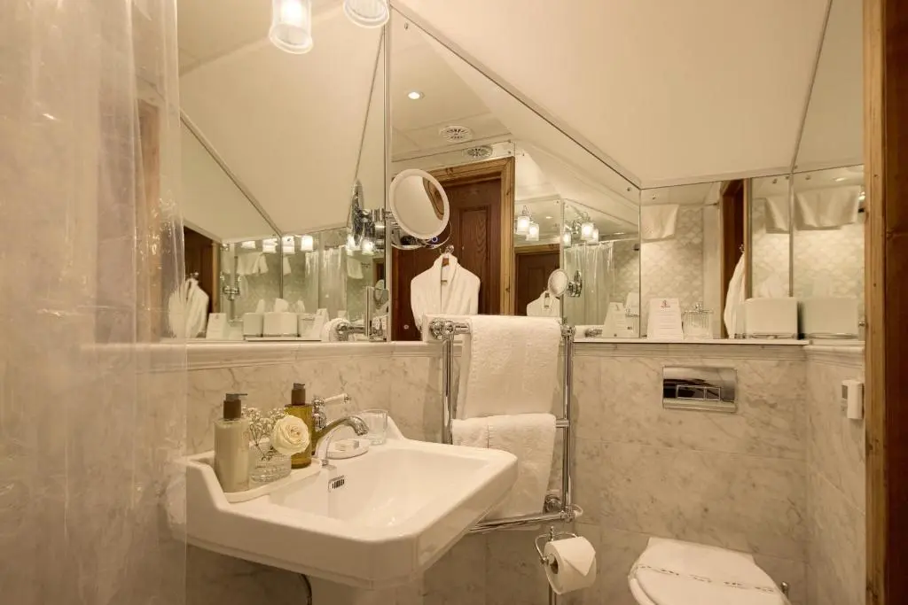 a bathroom with a sink and a mirror at The Ambassador Hotel in Inverness