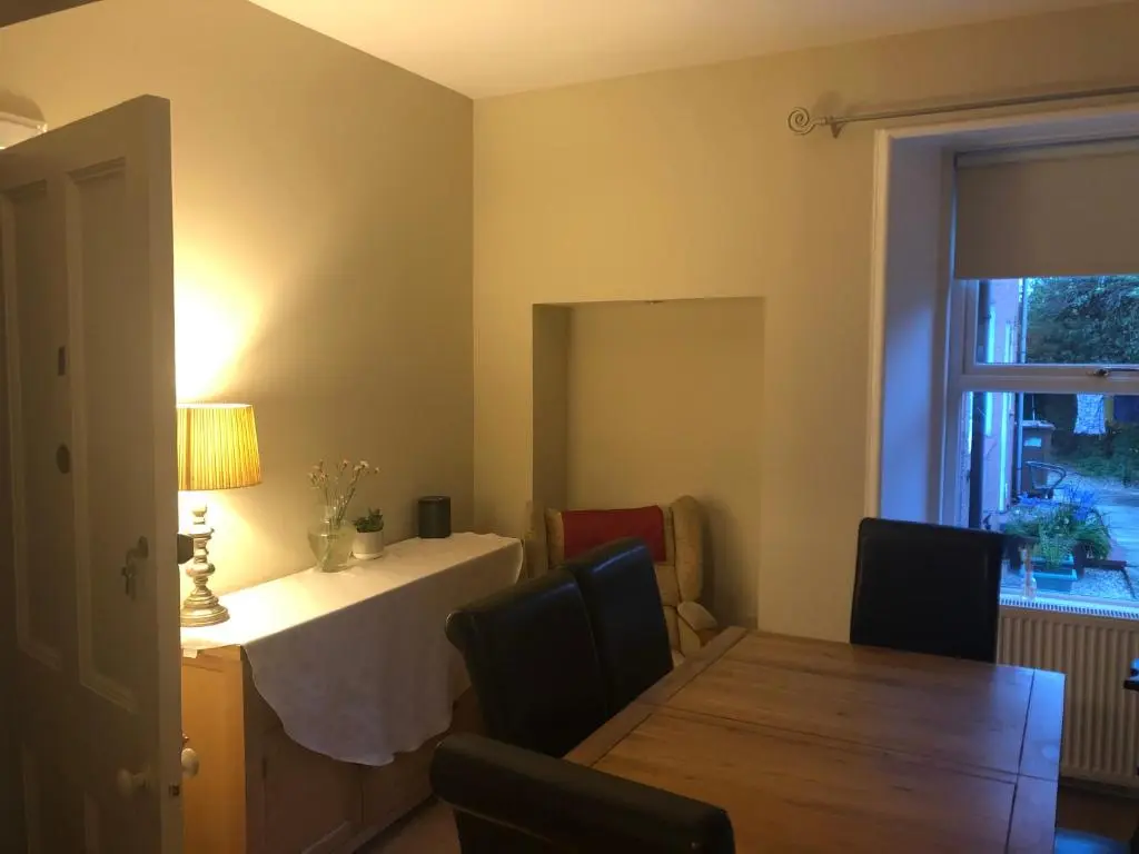 a dining room with a table and a dining room at Strathallan B&B in Inverness