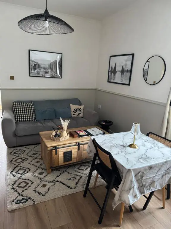 a living room with a couch and a table at Harbour quay in Wick