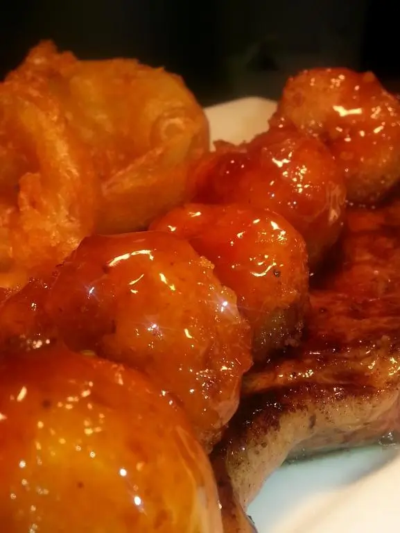 a pile of meat with sauce on a plate at The Davron Hotel in Fraserburgh