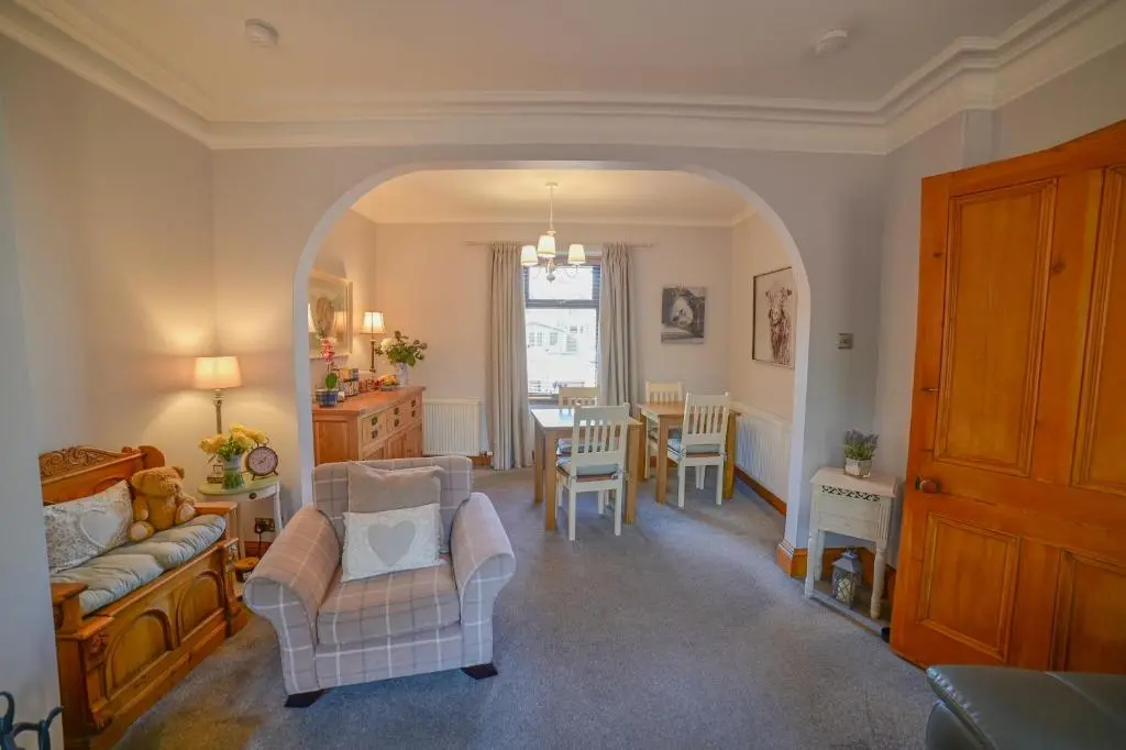 a living room with a couch and chairs and a table at Kylelachin in Dingwall