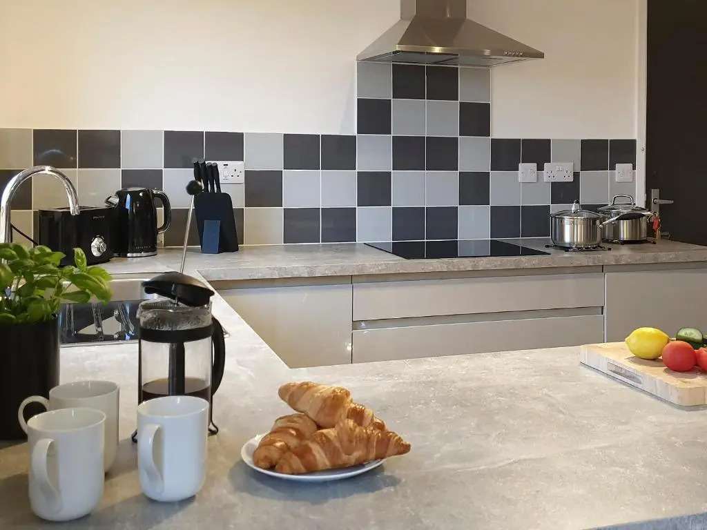 a kitchen with croissants and a plate of croissants on a counter at Auldfield in Lhanbryd