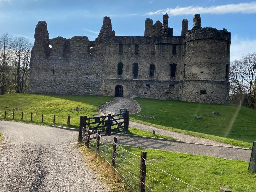 a castle with a fence in front of it at The Coffee Pot accommodation in Dufftown