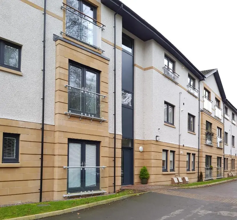 an apartment building with windows on a street at 23 Hedgefield House in Inverness