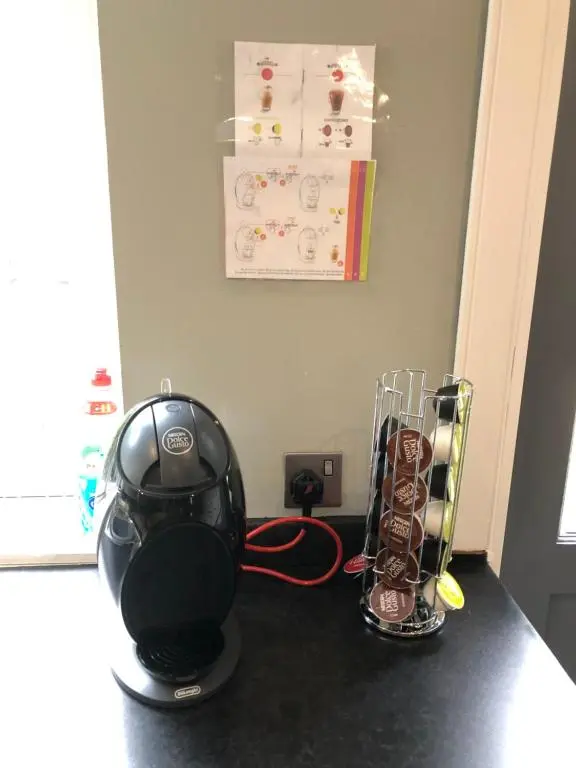 a counter top with a helmet and some chocolates at Rose Cottage in Inverness