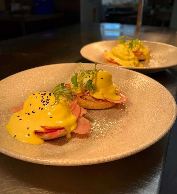 two plates of food with egg sandwiches on a table at The Knowes Hotel & Restaurant in Macduff