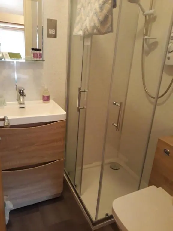 a bathroom with a shower and a sink at Gowanbrae in Dufftown