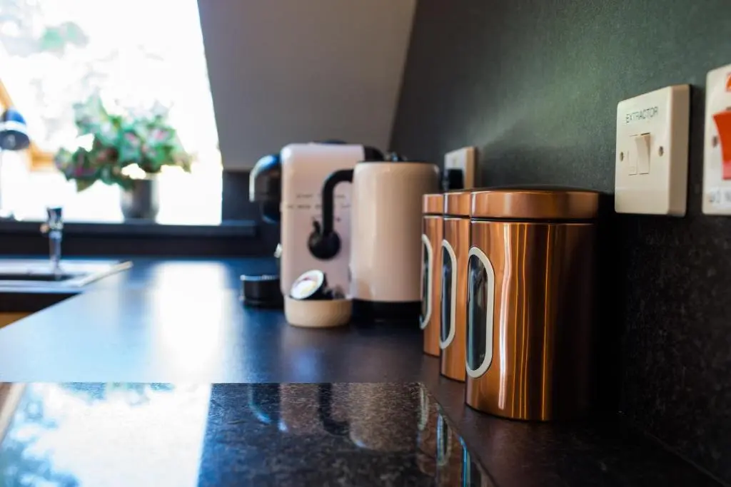 a row of coffee cups sitting on a counter at Mulberry in Nairn