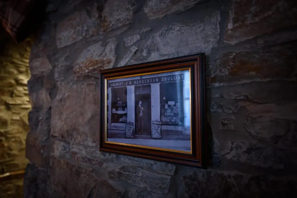 a picture on the wall of a stone wall at The Old Chemist in Cullen
