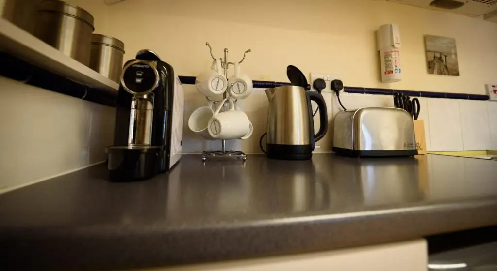 a kitchen counter with utensils on a counter top at The Old Chemist in Cullen