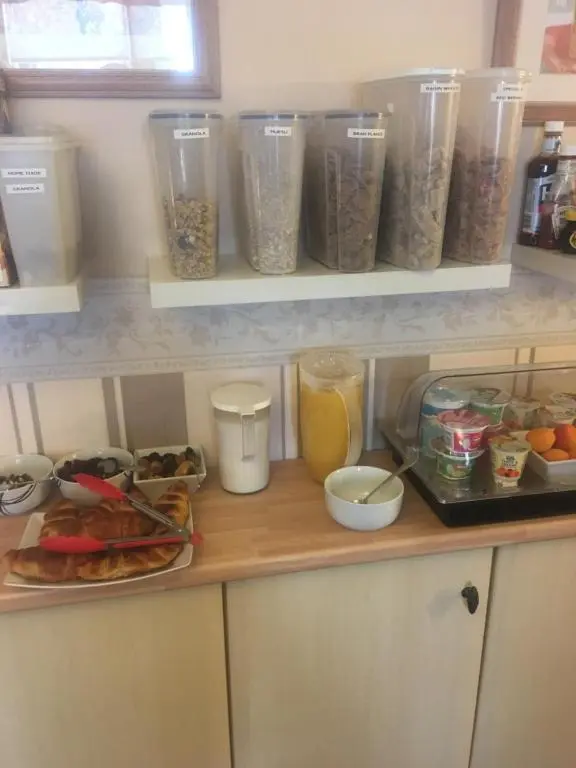 a kitchen counter with some food and other food items at Ivanhoe Guest House in Inverness