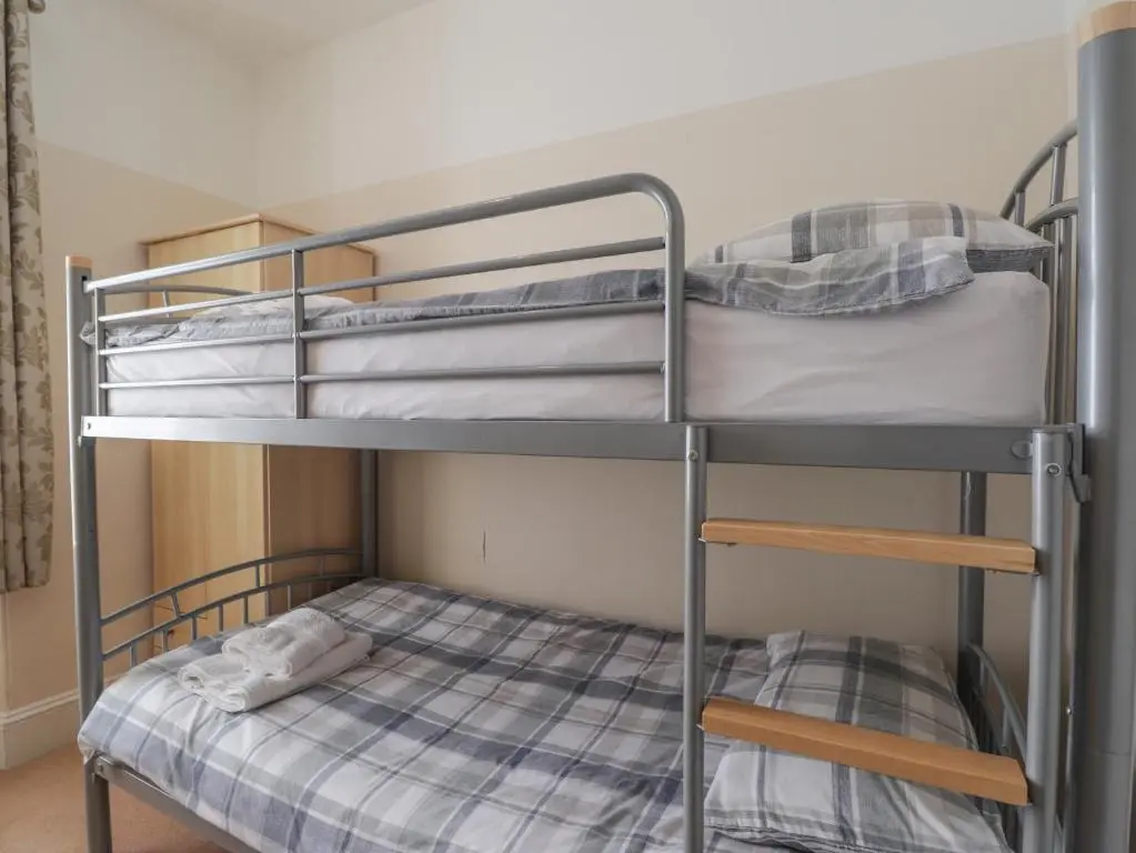 a bunk bed in a room with a bunk bedutenewayewayangering at 1 Seafield Street in Cullen