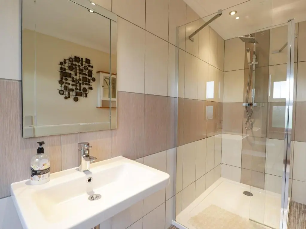 a bathroom with a sink and a shower at Bogairn in Carron