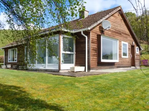 a small house with a lawn in front of it at Fronthill in Newtonmore