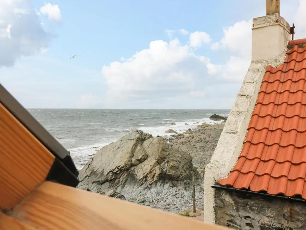 a view of the ocean from a house at 49 Crovie Village in Gardenstown