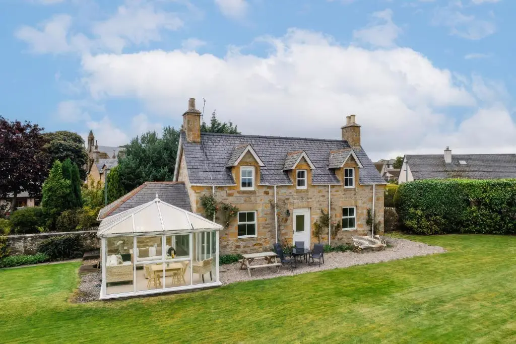 a house with a gazebo in the yard at Kerrisdale in Dornoch