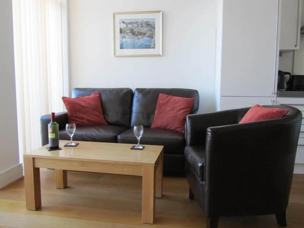 a living room with a couch and a coffee table at Bridge Street Apartments in Inverness