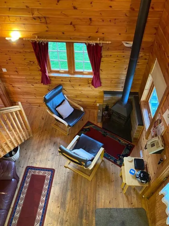 an overhead view of a living room with a stove at Parkmore Holiday Cottages in Dufftown