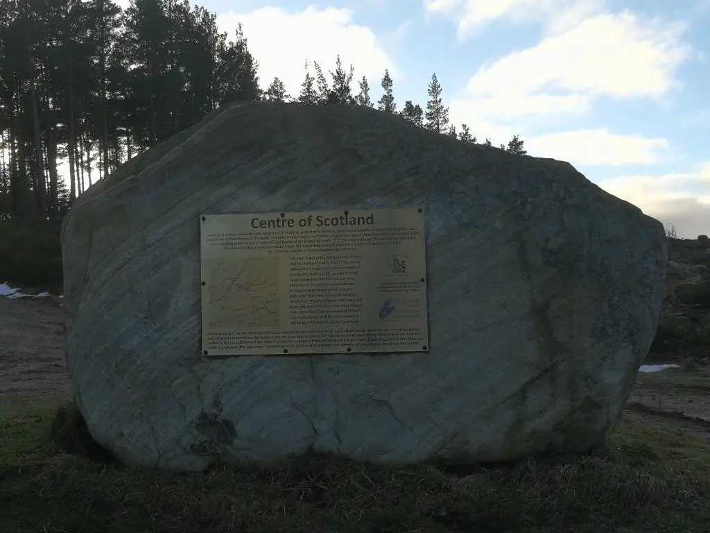 a large rock with a sign on top of it at Crubenbeg Country House in Newtonmore