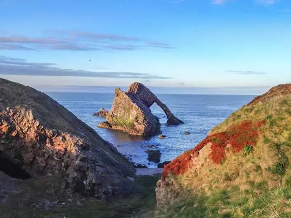 a group of rocks in the water near the ocean at Seascape in Buckie