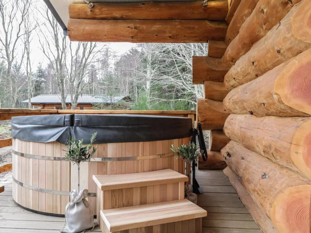 a sauna on the deck of a log cabin at Moorhen Lodge in Inverness